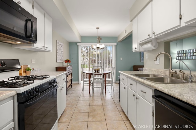 kitchen featuring white cabinetry, a sink, a chandelier, and black appliances