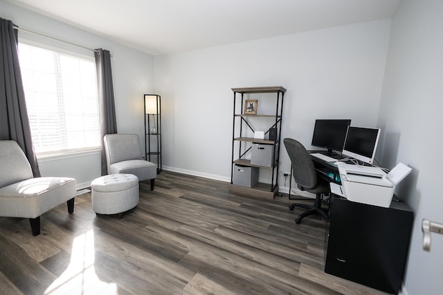 office space featuring baseboards and wood finished floors
