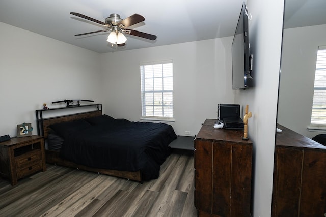 bedroom with ceiling fan and wood finished floors