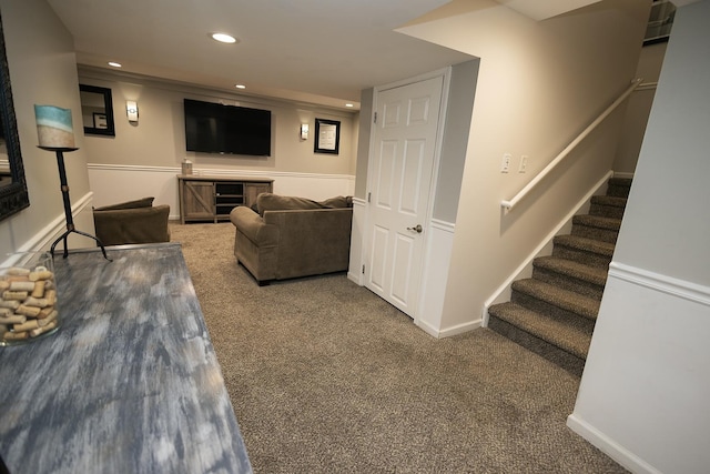 carpeted living area with stairs, recessed lighting, and baseboards
