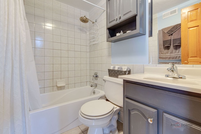 full bath featuring vanity, visible vents, toilet, shower / bath combo, and tile patterned floors