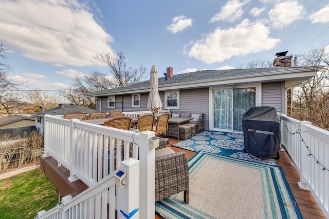 wooden deck with a grill and outdoor lounge area