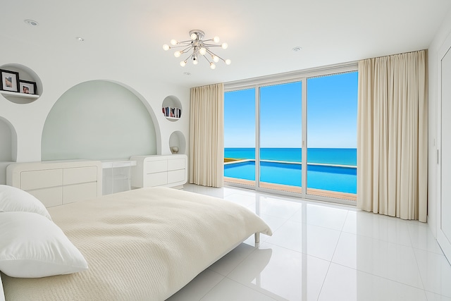 2441 Woodbridge Ln, Highland Park, IL 60035 - bedroom with expansive windows, a chandelier, tile patterned flooring, access to exterior, and a water view