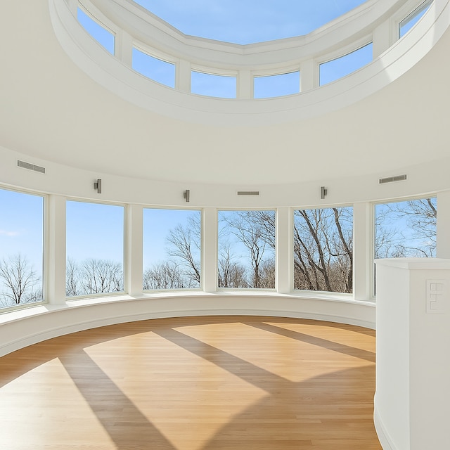 2441 Woodbridge Ln, Highland Park, IL 60035 - unfurnished sunroom featuring visible vents, a towering ceiling, and plenty of natural light