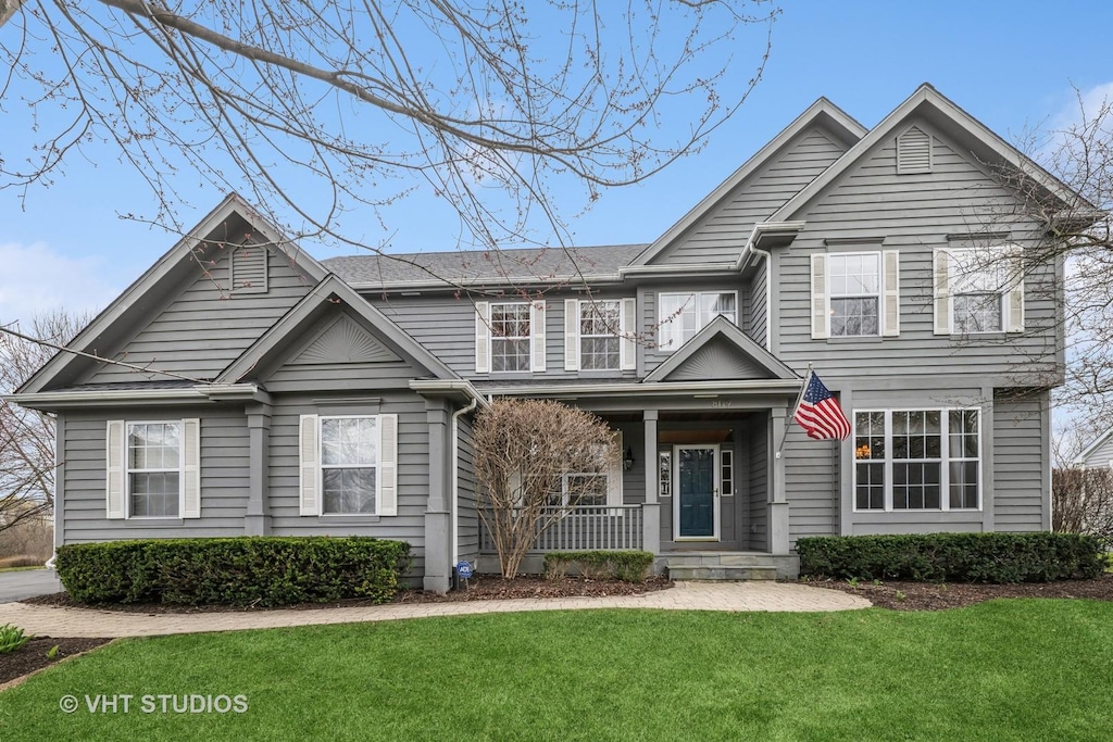 8119 Danneil Ct, Long Grove, IL 60047 - traditional-style home with a porch and a front lawn