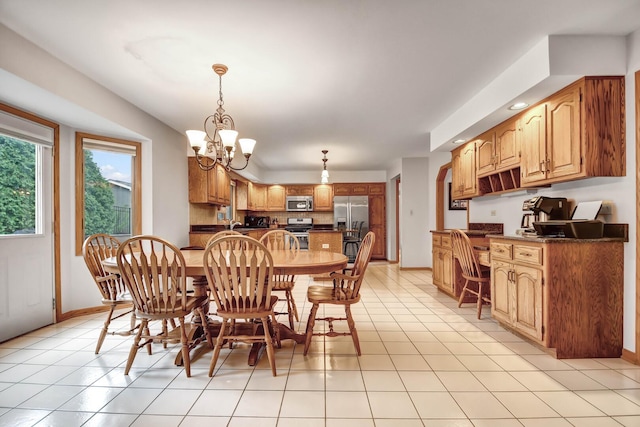 dining area with light tile patterned floors, baseboards, recessed lighting, and a notable chandelier