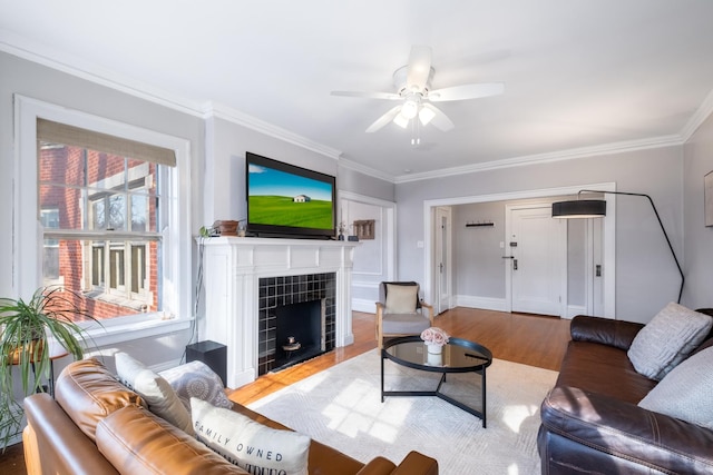 230 N Oak Park Ave Unit 2I, Oak Park, IL 60302 - living area with crown molding, wood finished floors, ceiling fan, and a tiled fireplace