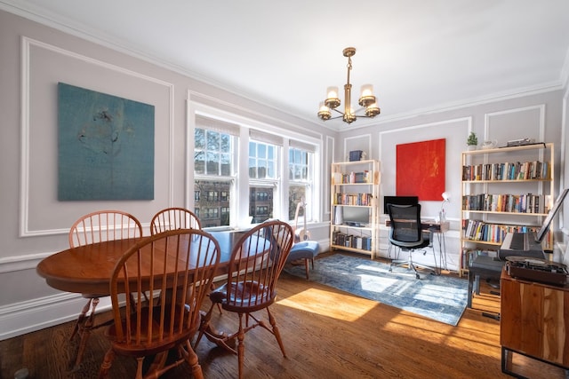 230 N Oak Park Ave Unit 2I, Oak Park, IL 60302 - dining room with a decorative wall, an inviting chandelier, ornamental molding, and wood finished floors