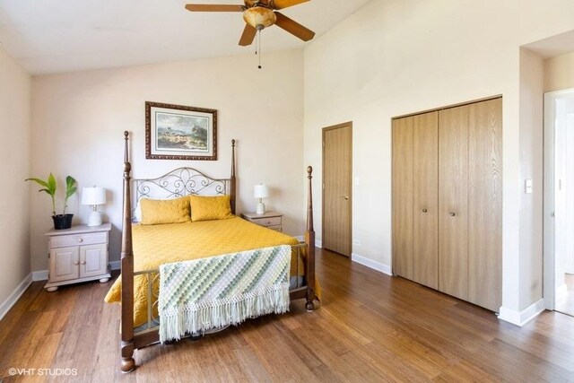 204 E Heritage Trl E, Hainesville, IL 60030 - bedroom with ceiling fan, baseboards, wood finished floors, multiple closets, and high vaulted ceiling