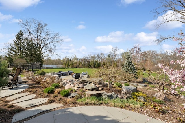 view of yard featuring fence and a patio area