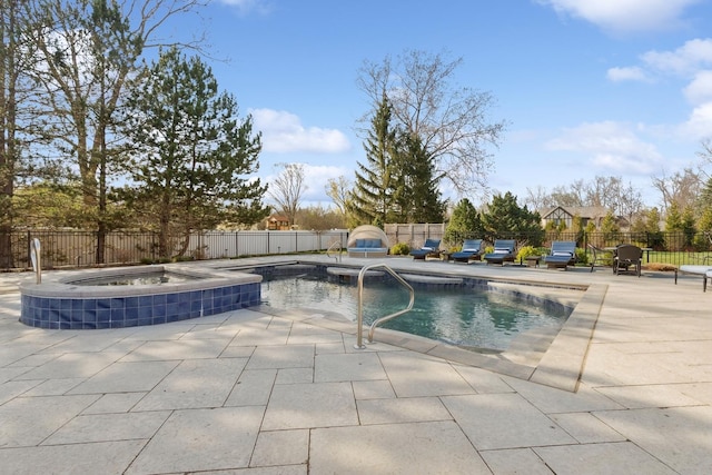 view of swimming pool featuring a patio area, an in ground hot tub, and a fenced backyard