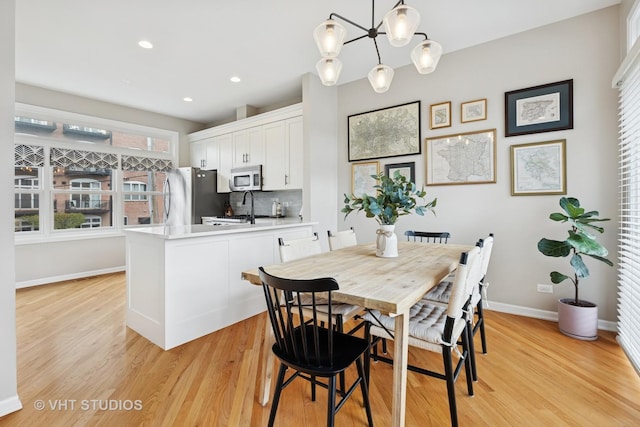 1806 W Byron St, Chicago, IL 60613 - dining space featuring baseboards, light wood finished floors, and recessed lighting