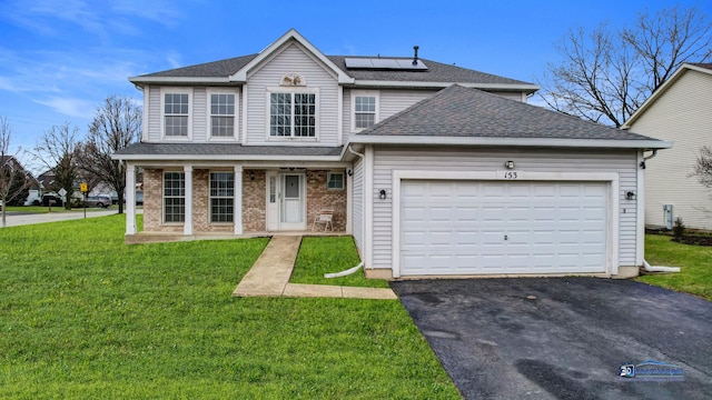153 Christine Way, Bolingbrook, IL 60440 - traditional home with aphalt driveway, a porch, a front lawn, solar panels, and an attached garage