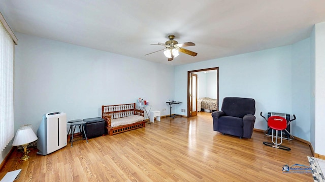 153 Christine Way, Bolingbrook, IL 60440 - living area with light wood-style flooring, baseboards, and a ceiling fan