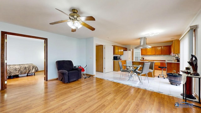 153 Christine Way, Bolingbrook, IL 60440 - interior space with light wood finished floors, ceiling fan, and baseboards