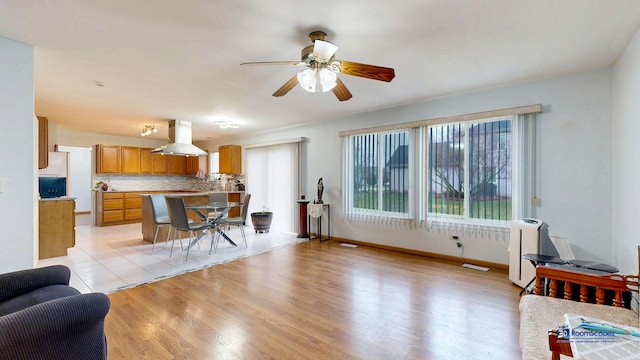 153 Christine Way, Bolingbrook, IL 60440 - kitchen with backsplash, open floor plan, a ceiling fan, and island exhaust hood