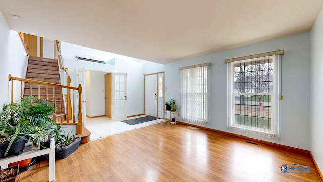 153 Christine Way, Bolingbrook, IL 60440 - foyer featuring stairs, visible vents, baseboards, and wood finished floors