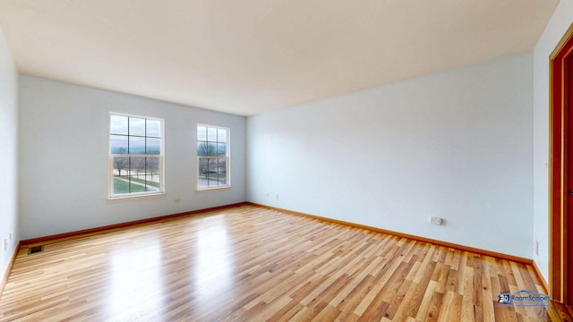 153 Christine Way, Bolingbrook, IL 60440 - unfurnished room with visible vents, light wood-type flooring, and baseboards