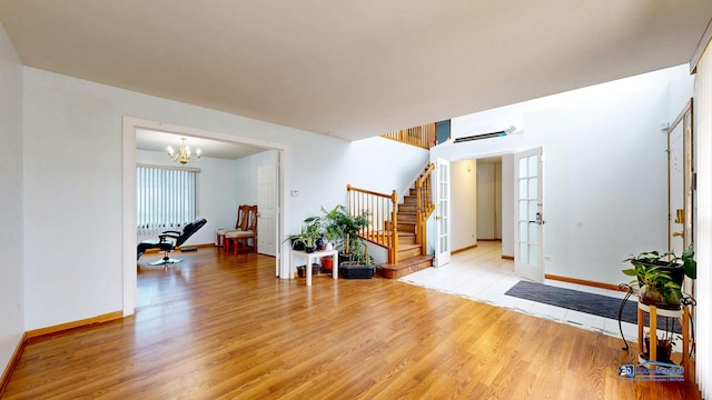 153 Christine Way, Bolingbrook, IL 60440 - entryway with light wood-style flooring, an inviting chandelier, baseboards, and stairs
