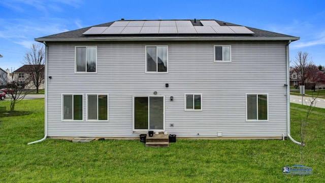153 Christine Way, Bolingbrook, IL 60440 - back of house with a lawn and roof mounted solar panels