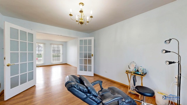 153 Christine Way, Bolingbrook, IL 60440 - workout room featuring a chandelier, french doors, baseboards, and wood finished floors