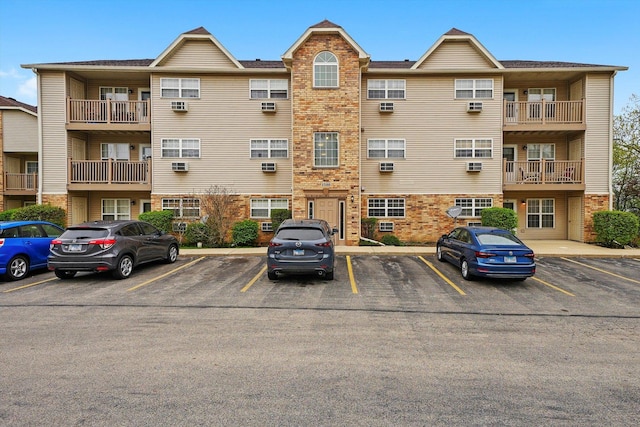 1580 W Sand Bar Ct Unit 1D, Round Lake Beach, IL 60073 - view of property featuring uncovered parking