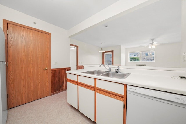 1580 W Sand Bar Ct Unit 1D, Round Lake Beach, IL 60073 - kitchen featuring white appliances, a sink, wainscoting, light countertops, and wooden walls
