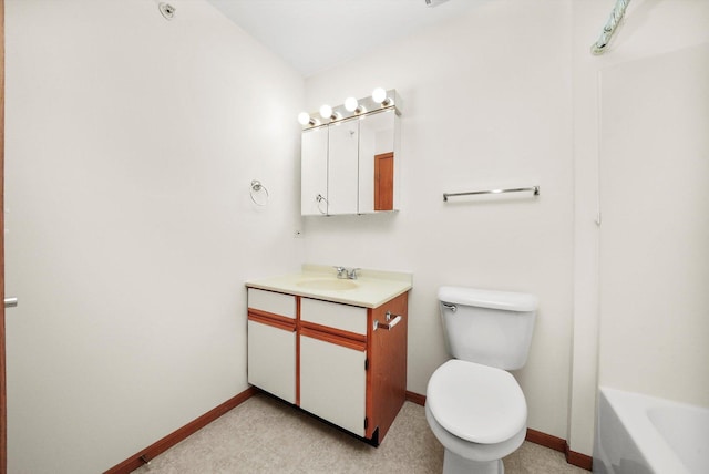 1580 W Sand Bar Ct Unit 1D, Round Lake Beach, IL 60073 - bathroom featuring baseboards, toilet, vanity, and a tub