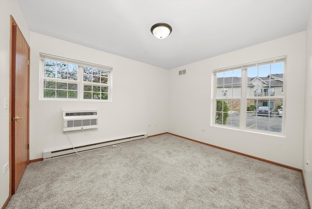 1580 W Sand Bar Ct Unit 1D, Round Lake Beach, IL 60073 - spare room featuring a baseboard radiator, carpet flooring, baseboards, and a wall mounted AC