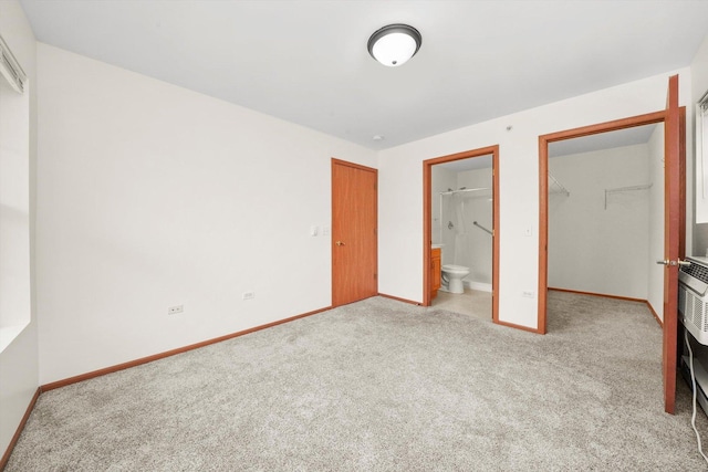 1580 W Sand Bar Ct Unit 1D, Round Lake Beach, IL 60073 - unfurnished bedroom featuring carpet floors, a closet, baseboards, a walk in closet, and ensuite bathroom