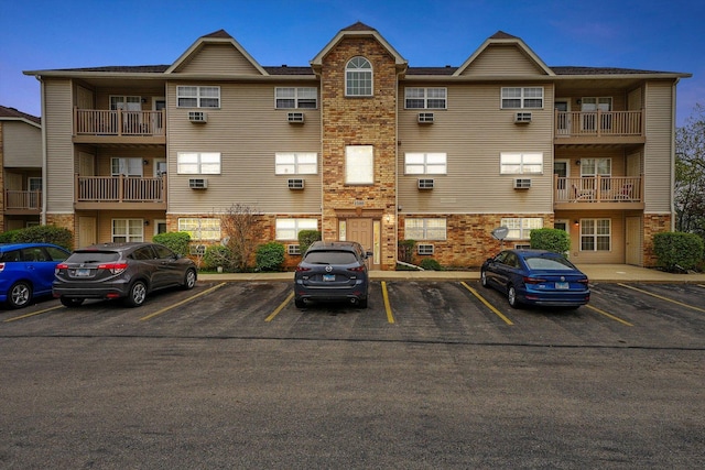 1580 W Sand Bar Ct Unit 1D, Round Lake Beach, IL 60073 - view of building exterior with uncovered parking