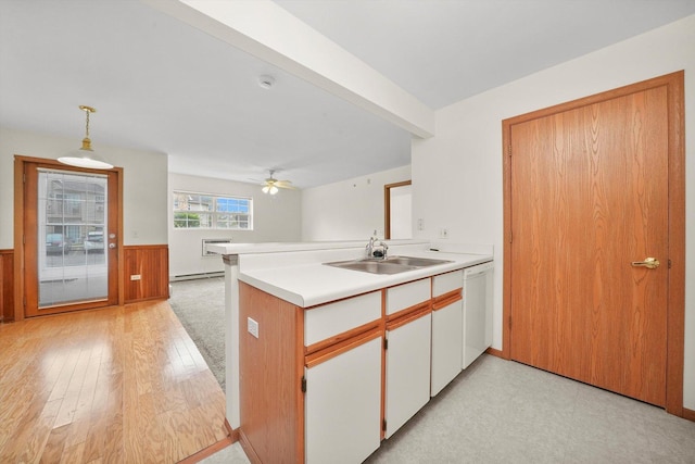 1580 W Sand Bar Ct Unit 1D, Round Lake Beach, IL 60073 - kitchen featuring a sink, white dishwasher, a wainscoted wall, a peninsula, and ceiling fan