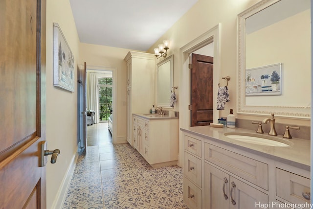 full bathroom with tile patterned floors, two vanities, a sink, and baseboards