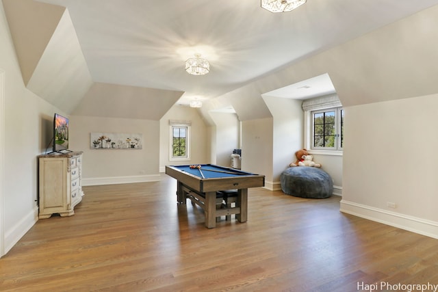 game room with baseboards, light wood-type flooring, pool table, and vaulted ceiling
