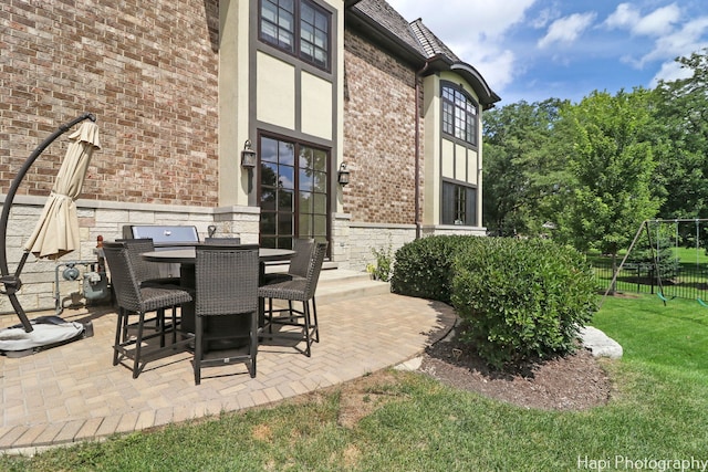 view of patio featuring fence and outdoor dining area