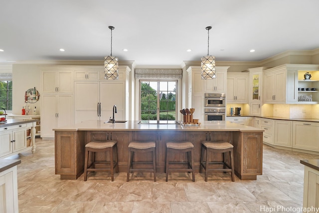 kitchen with tasteful backsplash, stainless steel double oven, a sink, and ornamental molding