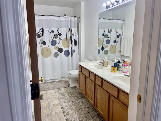 370 W Asbury Dr, Round Lake, IL 60073 - full bath with double vanity, toilet, a shower with shower curtain, and stone finish flooring