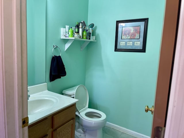 370 W Asbury Dr, Round Lake, IL 60073 - half bath featuring vanity, toilet, and baseboards