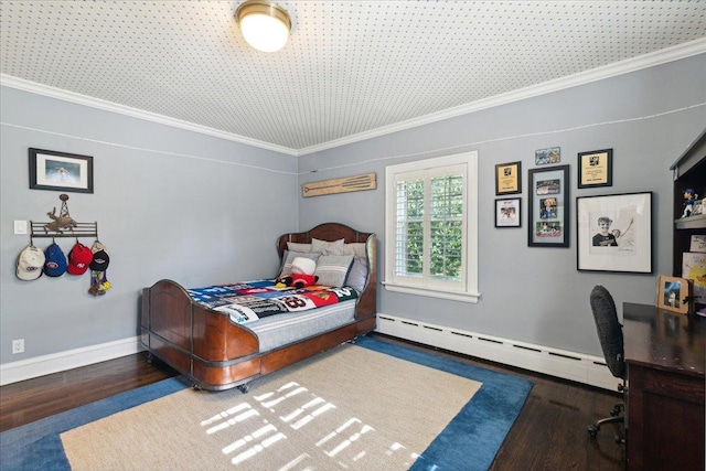 bedroom featuring baseboards, a baseboard heating unit, crown molding, and wood finished floors