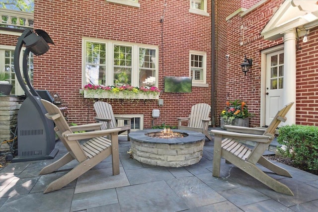view of patio / terrace featuring a fire pit