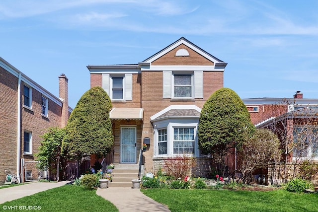 2732 W Chase Ave, Chicago, IL 60645 - traditional-style house featuring a front lawn and brick siding