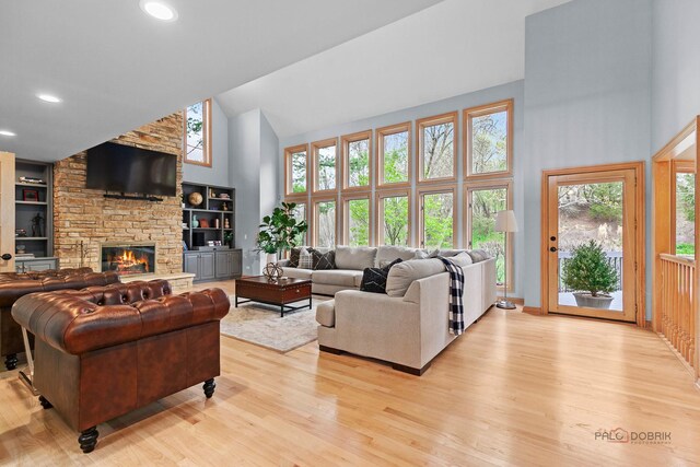 kitchen featuring a kitchen island, island range hood, gray cabinets, a sink, and stainless steel appliances