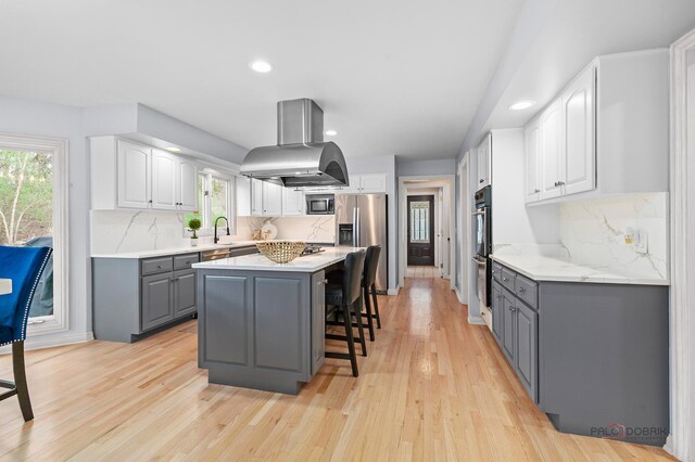 full bath with recessed lighting, a sink, baseboards, and two vanities