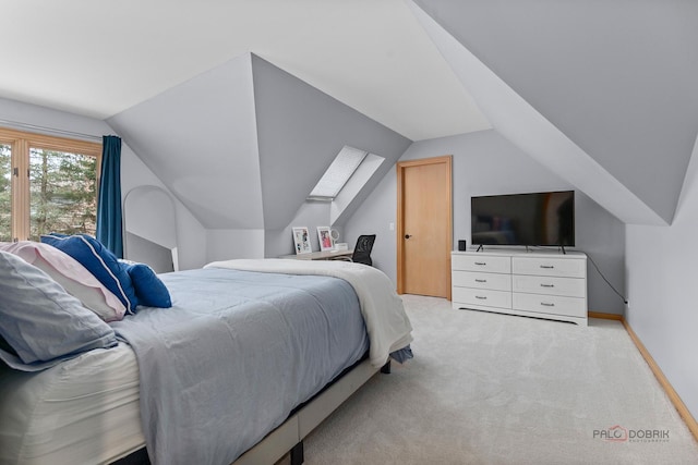 318 Camelot Ln, Libertyville, IL 60048 - bedroom featuring vaulted ceiling, carpet floors, baseboards, and a skylight