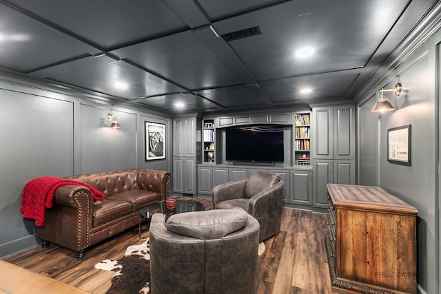 318 Camelot Ln, Libertyville, IL 60048 - home theater room with dark wood-style flooring, a decorative wall, built in shelves, recessed lighting, and baseboards