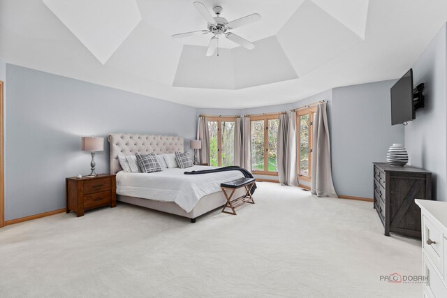 sitting room featuring a large fireplace, baseboards, and light colored carpet