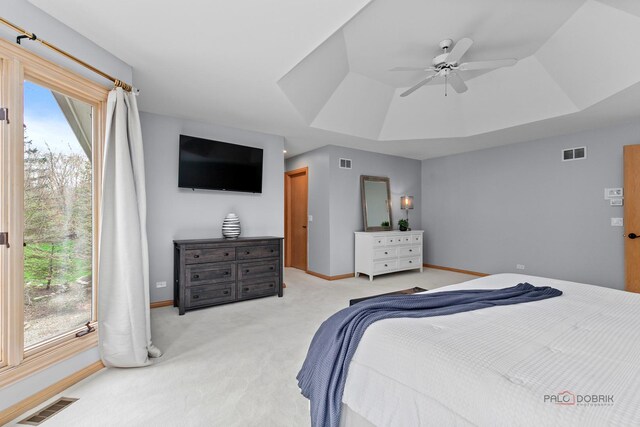 living area with a brick fireplace, baseboards, and light carpet