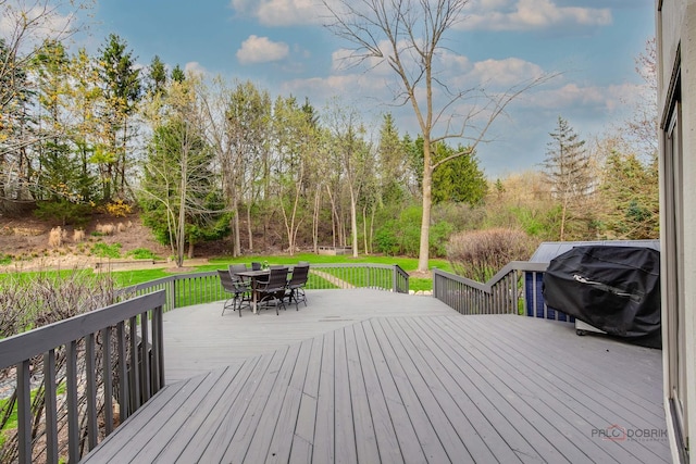 318 Camelot Ln, Libertyville, IL 60048 - wooden deck with outdoor dining space, area for grilling, and a lawn