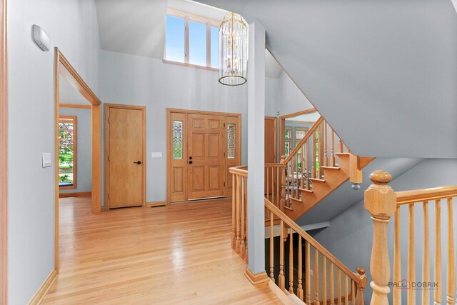 living area with crown molding, baseboards, and dark wood-style floors