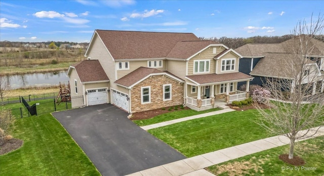 craftsman-style home featuring fence, a garage, a porch, a front yard, and driveway